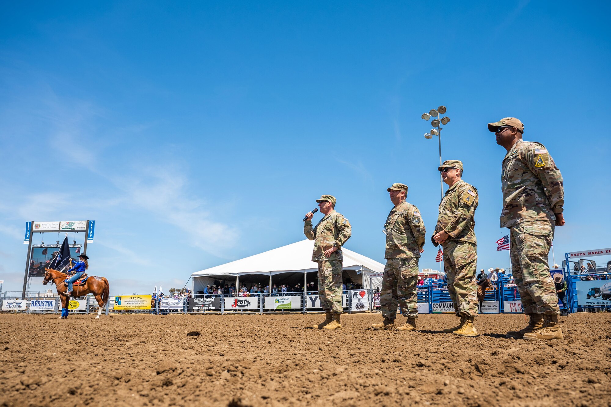 A U.S. Space Forces - Space commander and Combined Joint Force Space Component Commander, left, speaks to the crowd at the Santa Maria Elks Rodeo in Santa Maria.