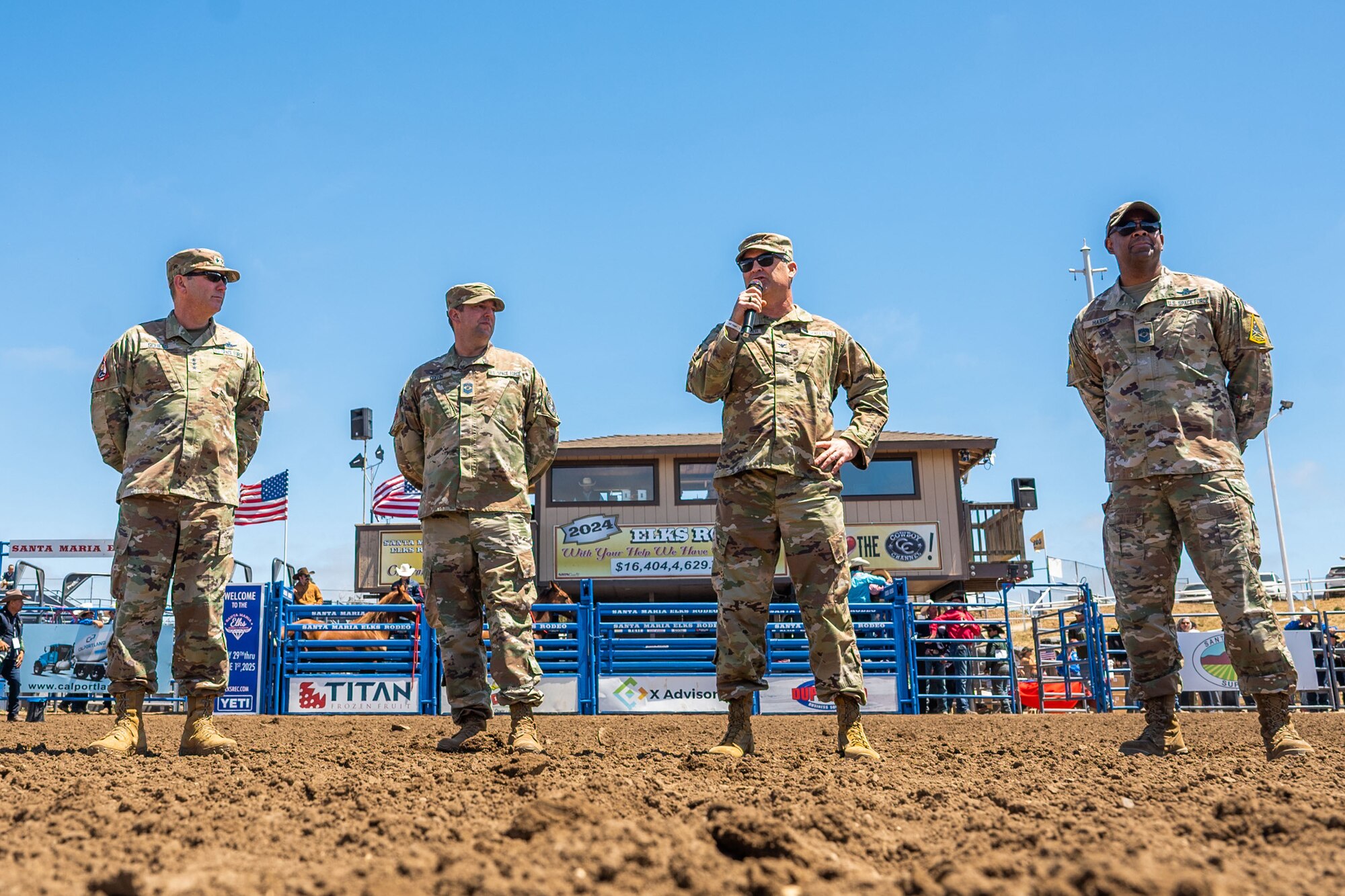 A Space Launch Delta 30 commander, middle-right, speaks to the crowd during the Santa Maria Elks Rodeo in Santa Maria.
