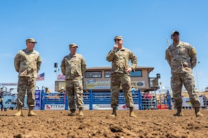A Space Launch Delta 30 commander, middle-right, speaks to the crowd during the Santa Maria Elks Rodeo in Santa Maria.