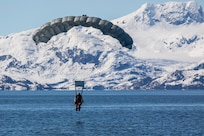 An Alaska Air National Guard pararescueman from the 212th Rescue Squadron descends during a freefall jump for water rescue training in the Prince William Sound near Whittier, Alaska, May 15, 2024. The Airmen of the 212th RQS are trained, equipped, and postured to conduct full-spectrum personnel recovery to include both conventional and unconventional rescue operations. The 212th, along with the 210th and 211th RQSs, make up the 176th Wing Rescue Triad and are among the busiest combat search and rescue units in the world. (Alaska National Guard photo by Alejandro Peña)