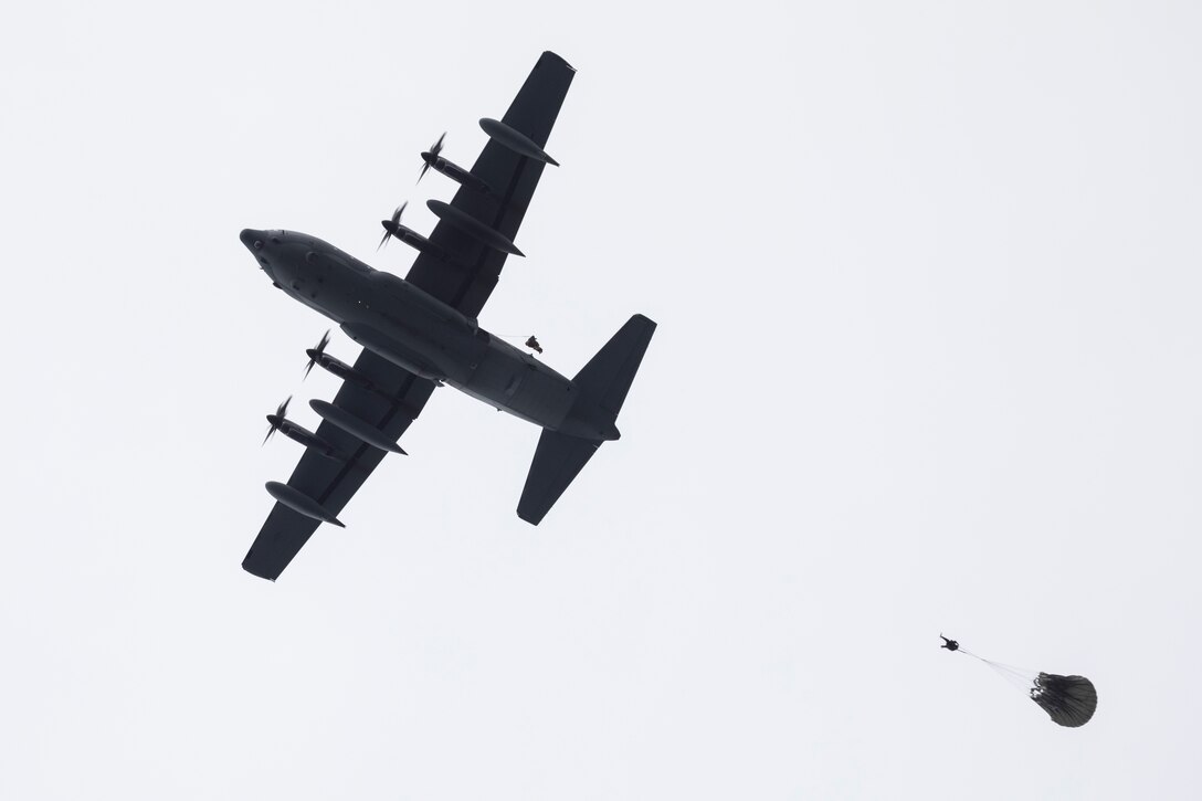 Alaska Air National Guard pararescuemen assigned to the 212th Rescue Squadron conduct a static line jump from a 211th Rescue Squadron HC-130J Combat King II during water rescue training in the Prince William Sound near Whittier, Alaska, May 16, 2024. The Airmen of the 212th RQS are trained, equipped, and postured to conduct full-spectrum personnel recovery to include both conventional and unconventional rescue operations. The 212th, along with the 210th and 211th RQSs, make up the 176th Wing Rescue Triad and are among the busiest combat search and rescue units in the world. (Alaska National Guard photo by Alejandro Peña)