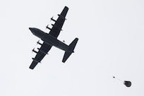 Alaska Air National Guard pararescuemen assigned to the 212th Rescue Squadron conduct a static line jump from a 211th Rescue Squadron HC-130J Combat King II during water rescue training in the Prince William Sound near Whittier, Alaska, May 16, 2024. The Airmen of the 212th RQS are trained, equipped, and postured to conduct full-spectrum personnel recovery to include both conventional and unconventional rescue operations. The 212th, along with the 210th and 211th RQSs, make up the 176th Wing Rescue Triad and are among the busiest combat search and rescue units in the world. (Alaska National Guard photo by Alejandro Peña)