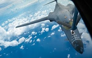A U.S. Air Force B-1B Lancer assigned to the 37th Expeditionary Bomb Squadron, Ellsworth Air Force Base, South Dakota, receives fuel from a 909th Air Refueling Squadron KC-135 Stratotanker during a routine Bomber Task Force mission over the South China Sea, May 31, 2024. BTF missions provide opportunities to train and work with Allies and partners in joint and coalition operations and exercises. (U.S. Air Force photo by Senior Airman Cedrique Oldaker)
