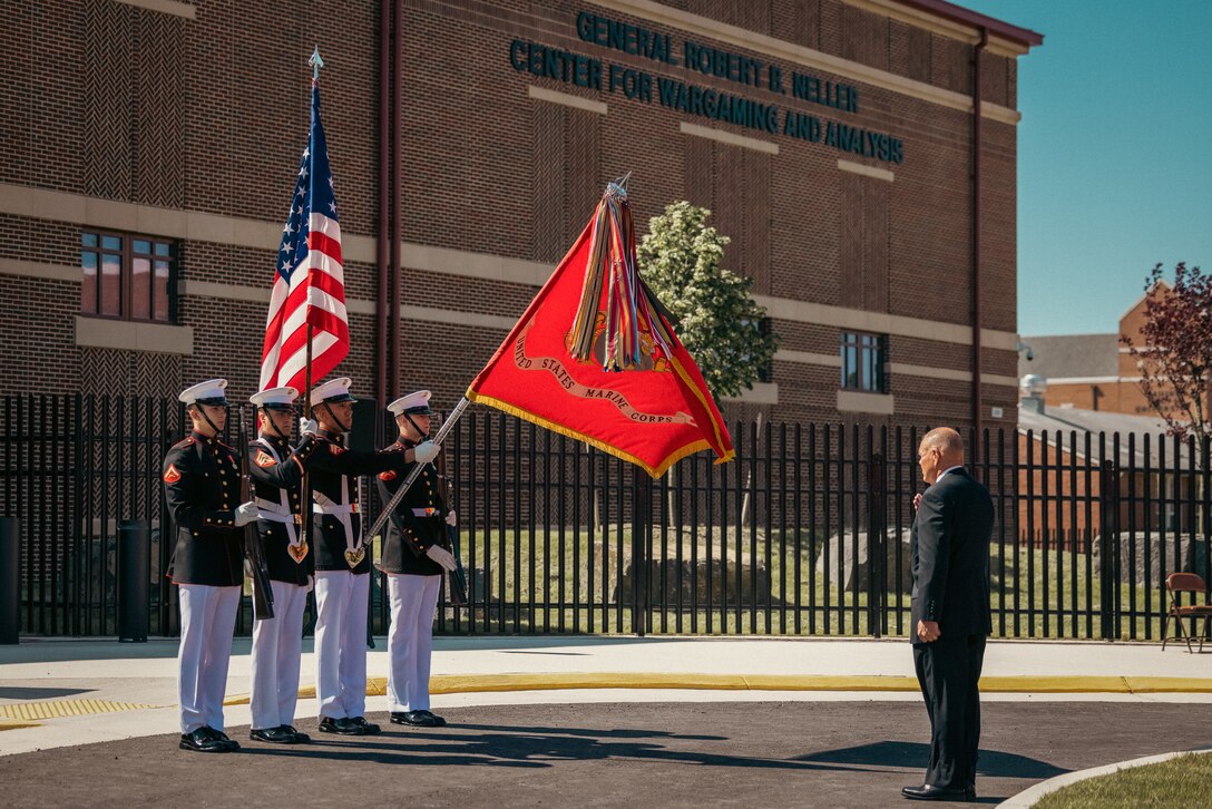 U.S. Marines with the Commandant’s Four carry the colors to give honors to Retired Gen. Robert Neller, the 37th commandant of the Marine Corps, during the dedication ceremony for the General Robert B. Neller Center for Wargaming and Analysis on Marine Corps Base Quantico, May 31, 2024. The Commandant’s Four is the Marine Corps’ official color guard. The new building will be a center for Marines to wargame in a secure, centralized, location to enhance the Marine Corps’ ability to make analytically informed decisions. (U.S. Marine Corps photo by Lance Cpl. Ethan Miller)
