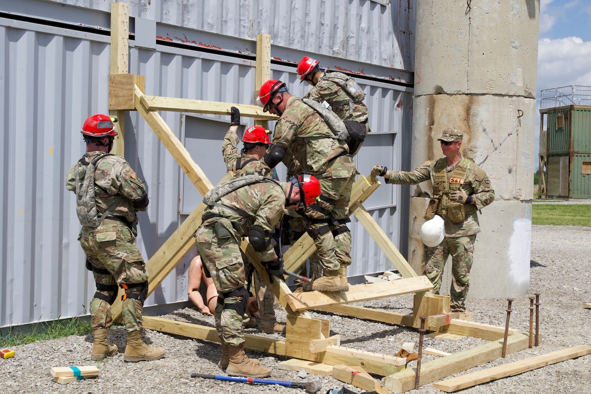 The Illinois Army and Air National Guard’s Chemical, Biological, Radiological, Nuclear, and Explosive Enhanced Response Force Package Search and Extraction Team built a protective barrier to treat the wounded during a training exercise in Sparta, Illinois, May 2-5, 2024. The exercise focused on enhancing the readiness and capabilities of CERFP units.