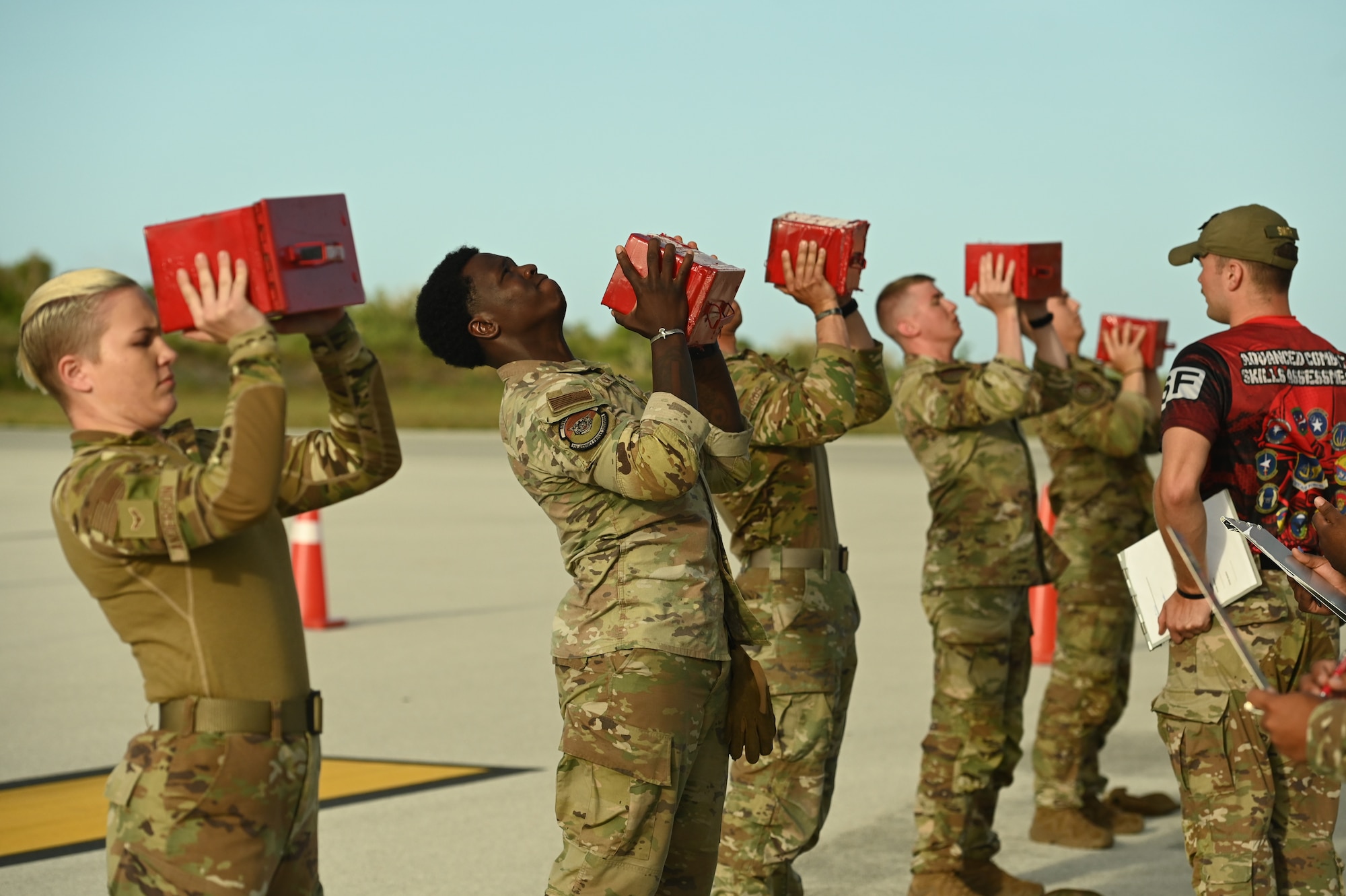 U.S. Air Force service members assigned to the 354th Security Forces Squadron, Eilson Air Force Base, Alaska, compete in an ammo can lift fitness assessment, at the Pacific Regional Training Center- Andersen, Guam, May 20, 2024. Fifteen teams across the Pacific Air Forces and allied nations competed against each other during a week-long Advanced Combat Fitness Assessment Competition hosted by the 736th SFS. (U.S. Air Force photo by Airman 1st Class Natasha Ninete)