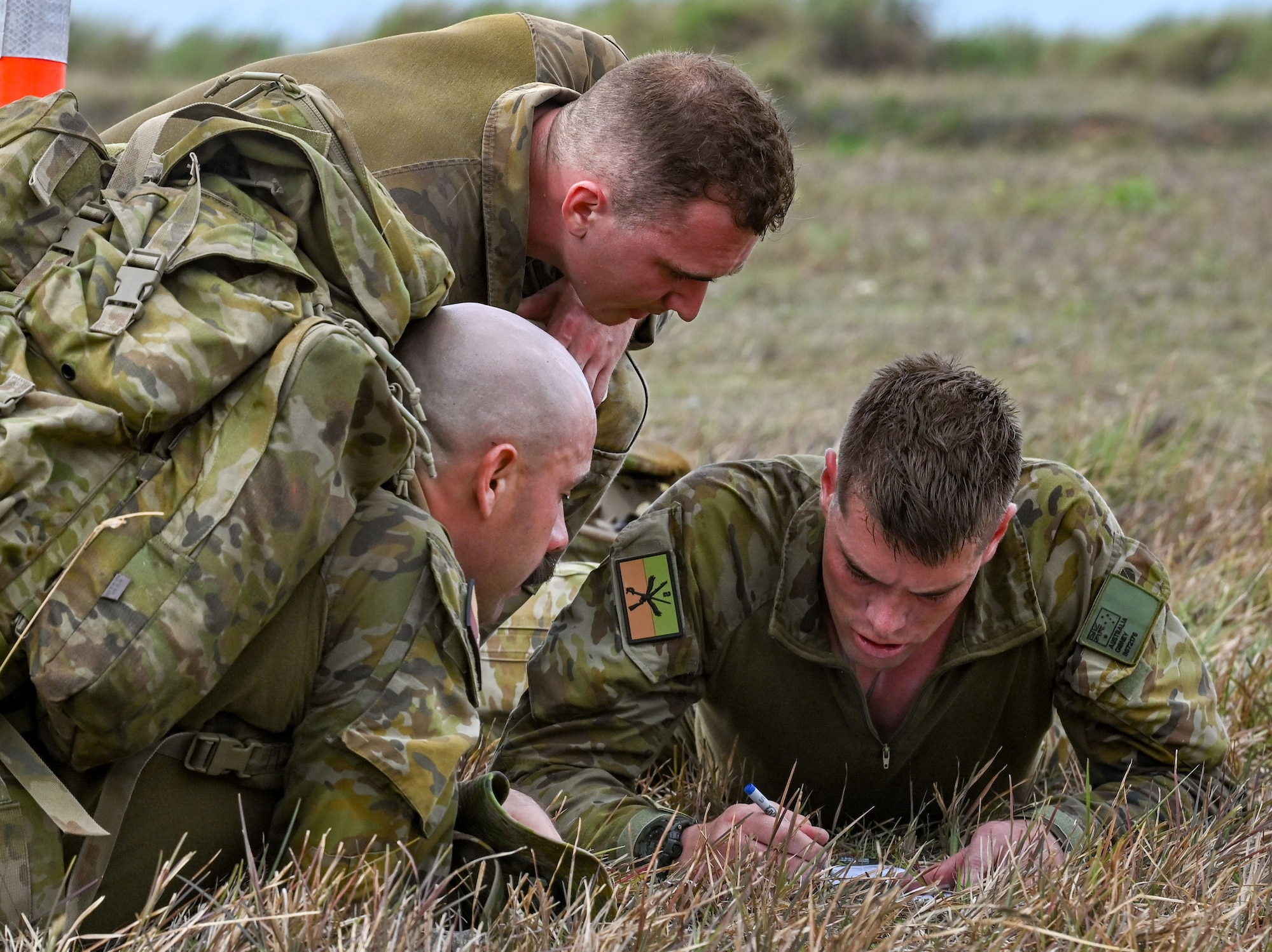 The Royal Australian Air Force team plot the coordinates during the Combat Tactics, Endurance and Agility Assessment at the Pacific Regional Training Center-Andersen, Guam, May 23, 2024. The RAAF was one of three international teams that participated in the 7th Annual Advanced Combat Skills Assessment hosted by the Pacific Air Forces.  Besides Australia, the United Kingdom and Japan sent their own representatives. (U.S. Air Force photo by Airman 1st Class Natasha Ninete)