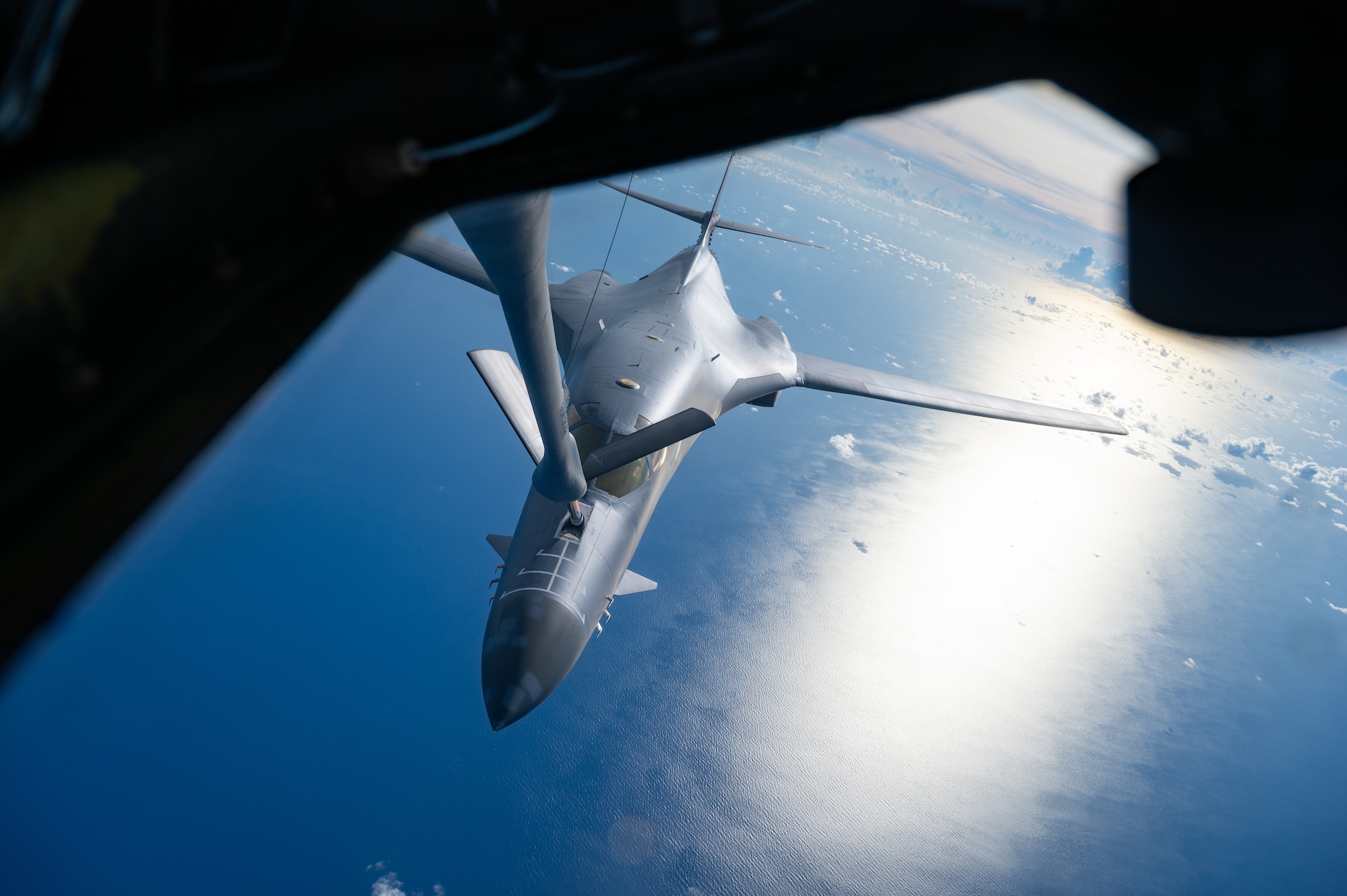 A U.S. Air Force B-1B Lancer assigned to the 37th Expeditionary Bomb Squadron, Ellsworth Air Force Base, S.D., conducts aerial refueling with a 909th Air Refueling Squadron KC-135 Stratotanker during a bomber task force mission over the South China Sea, May 31, 2024. Bomber missions enhance readiness, to include joint and multi-lateral, to respond to any potential crisis or challenge in the Indo-Pacific. (U.S. Air Force photo by Senior Airman Tylir Meyer)