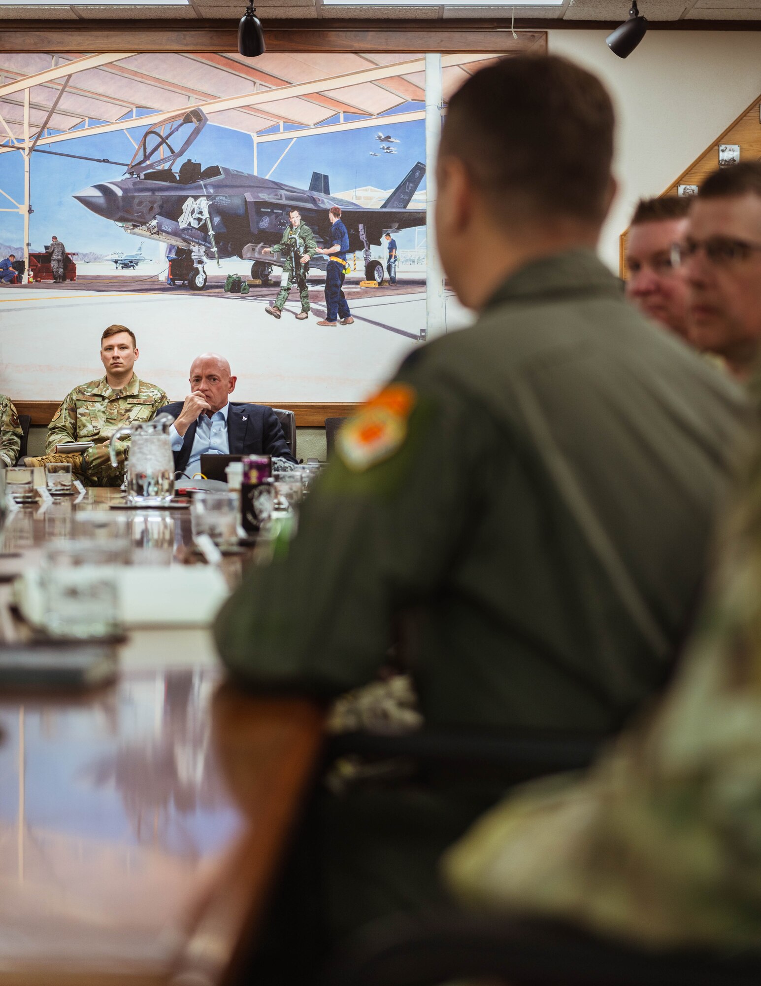 U.S. Senator Mark Kelly speaks with 56th Fighter Wing leadership.