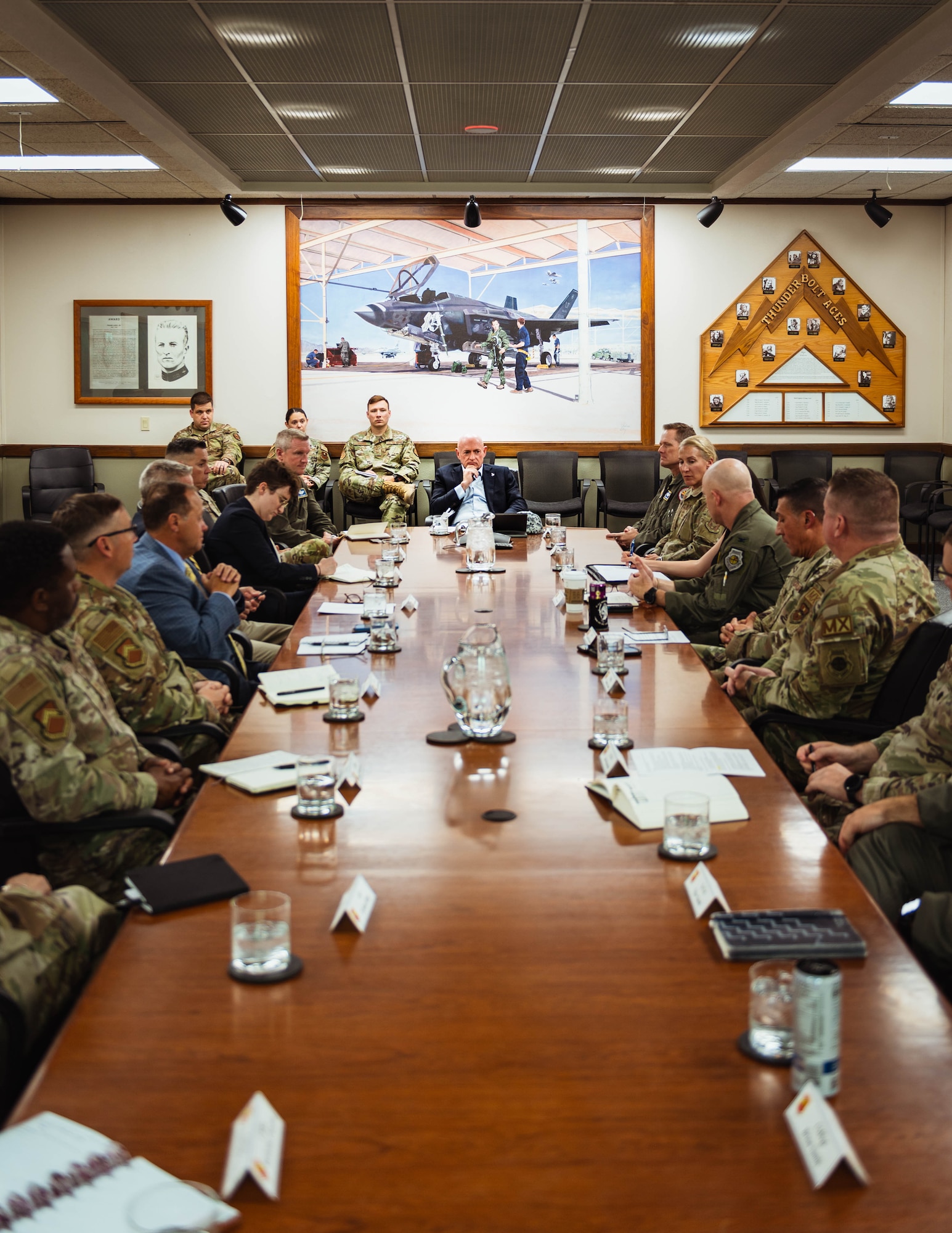 U.S. Senator Mark Kelly speaks with 56th Fighter Wing leadership.