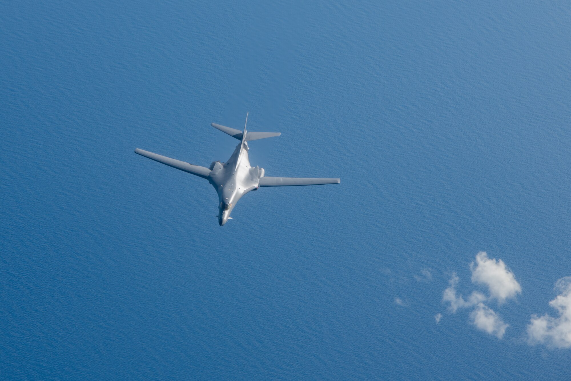 A U.S. Air Force B-1B Lancer assigned to the 37th Expeditionary Bomb Squadron, Ellsworth Air Force Base, S.D., departs after aerial refueling during a bomber task force mission over the South China Sea, May 31, 2024. Bomber missions contribute to joint force lethality and deter aggression in the Indo-Pacific by demonstrating U.S. Air Force ability to operate anywhere in the world at any time. (U.S. Air Force photo by Senior Airman Tylir Meyer)