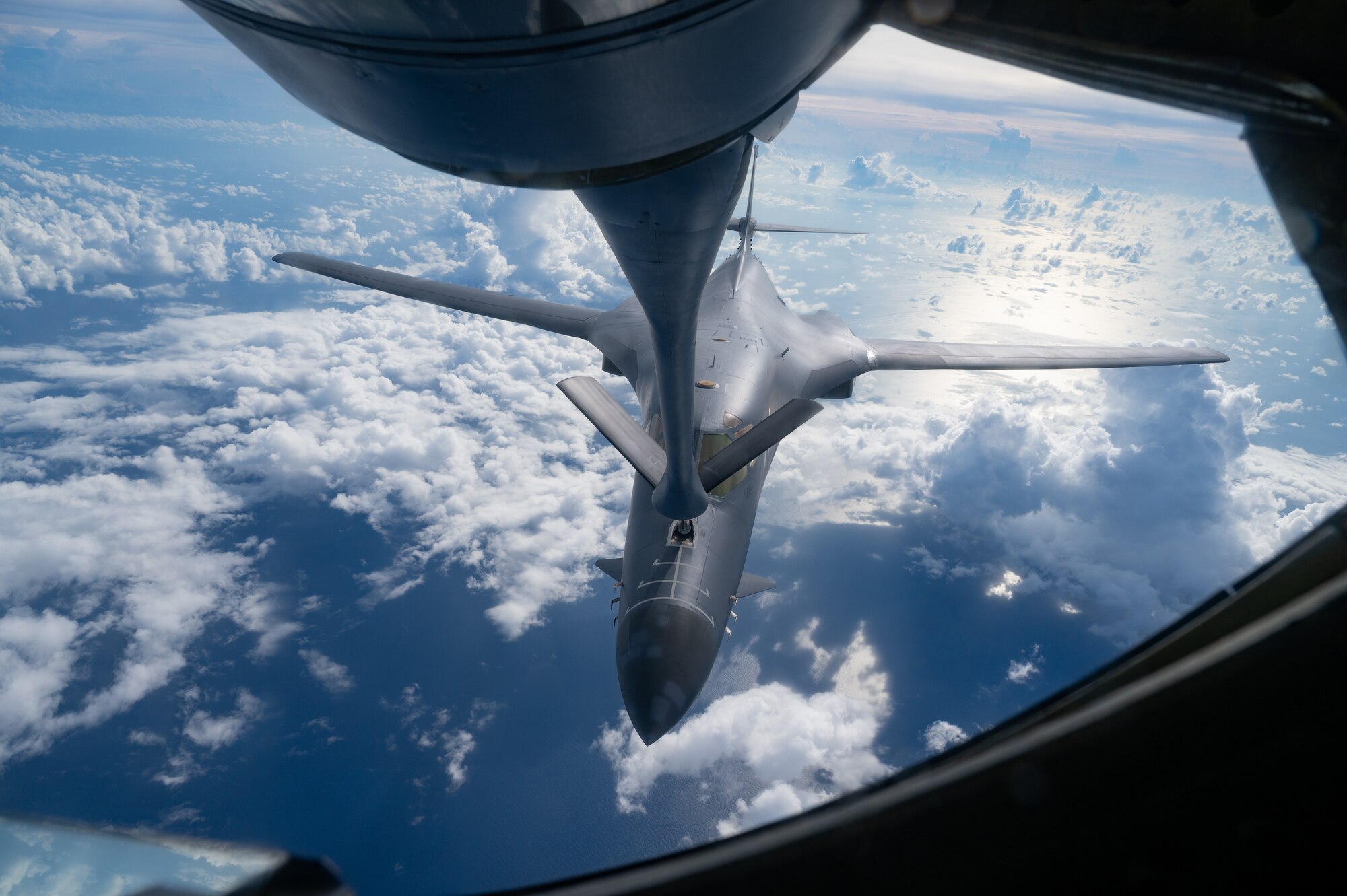 A U.S. Air Force B-1B Lancer assigned to the 37th Expeditionary Bomb Squadron, Ellsworth Air Force Base, S.D., conducts aerial refueling with a 909th Air Refueling Squadron KC-135 Stratotanker during a bomber task force mission over the South China Sea, May 31, 2024. Bomber missions contribute to joint force lethality and deter aggression in the Indo-Pacific by demonstrating U.S. Air Force ability to operate anywhere in the world at any time. (U.S. Air Force photo by Senior Airman Tylir Meyer)