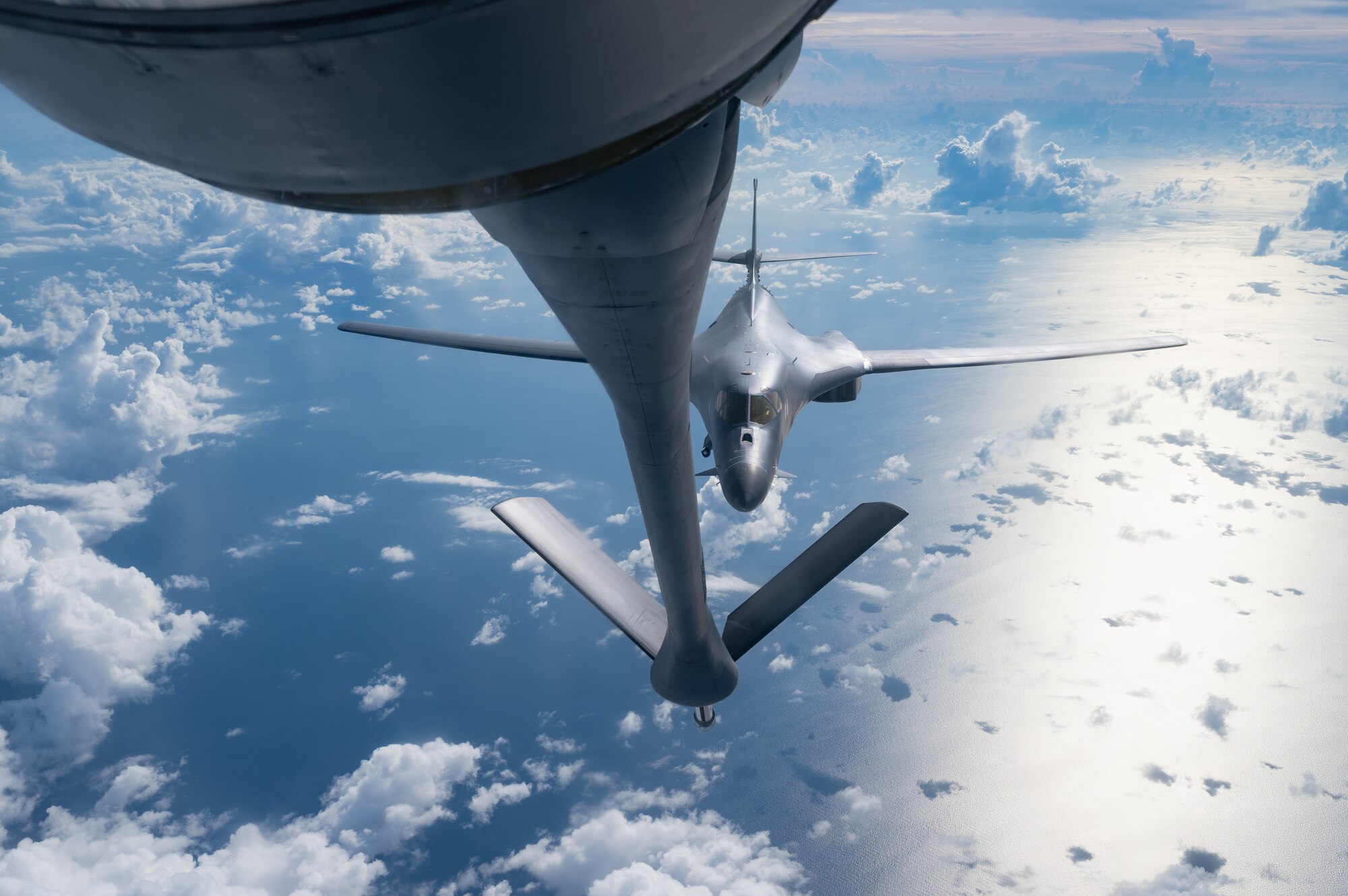 A U.S. Air Force B-1B Lancer assigned to the 37th Expeditionary Bomb Squadron, Ellsworth Air Force Base, S.D., approaches a 909th Air Refueling Squadron KC-135 Stratotanker to conduct aerial refueling during a bomber task force mission over the South China Sea, May 31, 2024. Bomber missions contribute to joint force lethality and deter aggression in the Indo-Pacific by demonstrating U.S. Air Force ability to operate anywhere in the world at any time. (U.S. Air Force photo by Senior Airman Tylir Meyer)