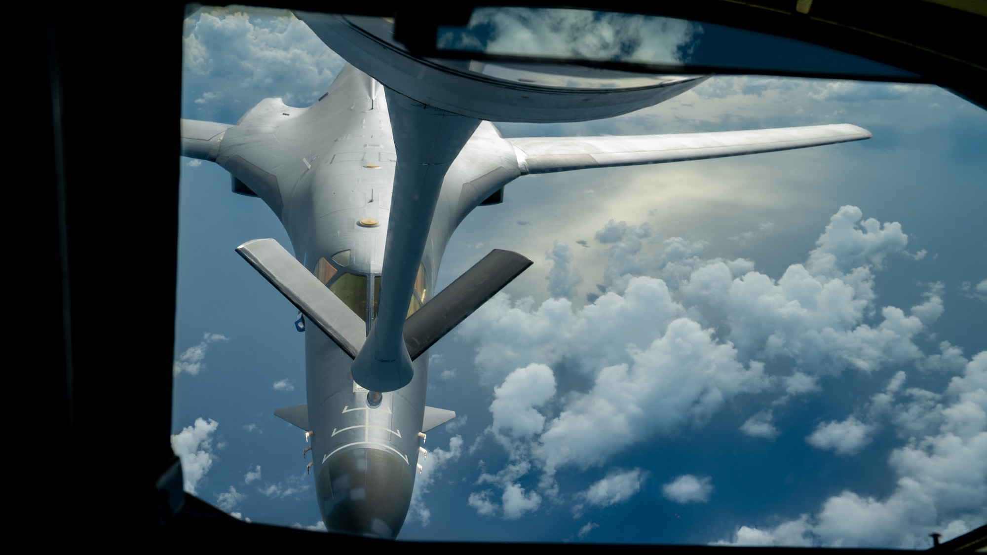 A U.S. Air Force B-1B Lancer assigned to the 37th Expeditionary Bomb Squadron, Ellsworth Air Force Base, South Dakota, receives fuel from a 909th Air Refueling Squadron KC-135 Stratotanker during a routine Bomber Task Force mission over the South China Sea, May 31, 2024. These missions enhance the U.S. Air Force, joint and multilateral readiness to respond to any potential crisis or challenge in the Indo-Pacific. (U.S. Air Force photo by Senior Airman Cedrique Oldaker)