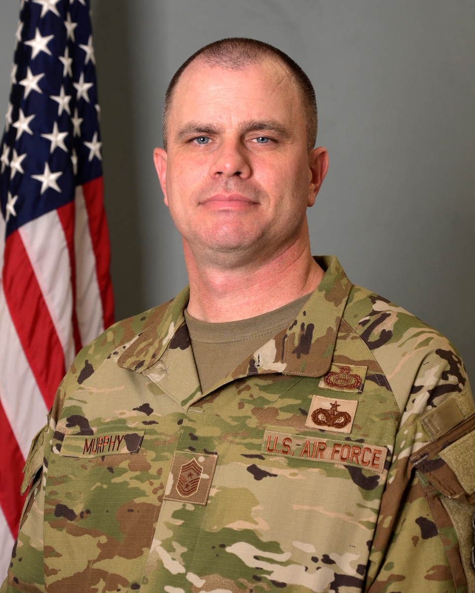 Chief Master Sergeant Christopher Murphy is the Command Chief, 379th Air Expeditionary Wing, Al Udeid Air Base, Qatar. In this capacity, he is the commander’s principal enlisted leader, supporting the readiness and effective utilization of more than 7,800 Air Force, joint, and coalition forces as well as 55 mission partners at the largest composite wing within the Middle Eastern theater of operations. The 379th AEW encompasses airlift; aerial refueling; intelligence, surveillance and reconnaissance; and aeromedical evacuation assets which support operations INHERENT RESOLVE, SPARTAN SHIELD, PROSPERITY GUARDIAN, and POSEIDON ARCHER. Chief Murphy also serves as key advisor to the commander on all health, morale, welfare, training, quality of life, professional development, and effective resources allocation matters.