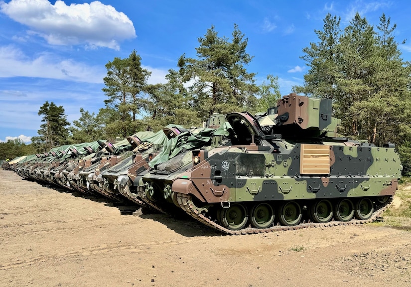 : A line of Bradley Fighting Vehicles is positioned at an Equipment Configuration and Hand-off Area in Trzebien, Poland. Army Field Support Battalion-Poland issued nearly 100 Bradley Fighting Vehicles to Soldiers from 1st Armored Brigade Combat Team, 1st Cavalry Division at two locations in Poland and one in Lithuania, May 20-31. (U.S. Army courtesy photo)