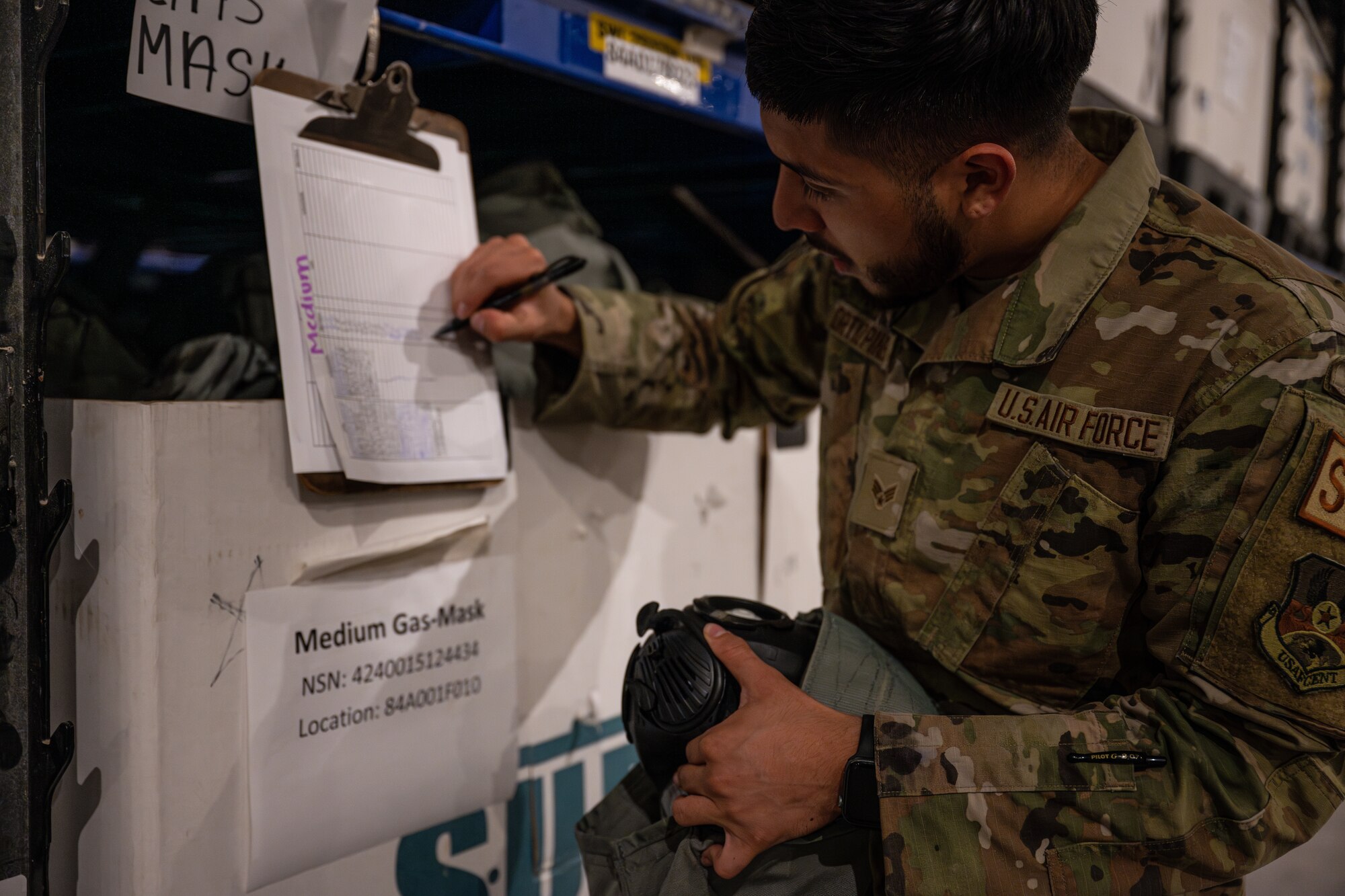 An Airman assigned to the 379th Expeditionary Logistics Readiness Squadron takes accountability of gear during an inspection at an undisclosed location in the U.S. Central Command area of responsibility, May 31, 2024.