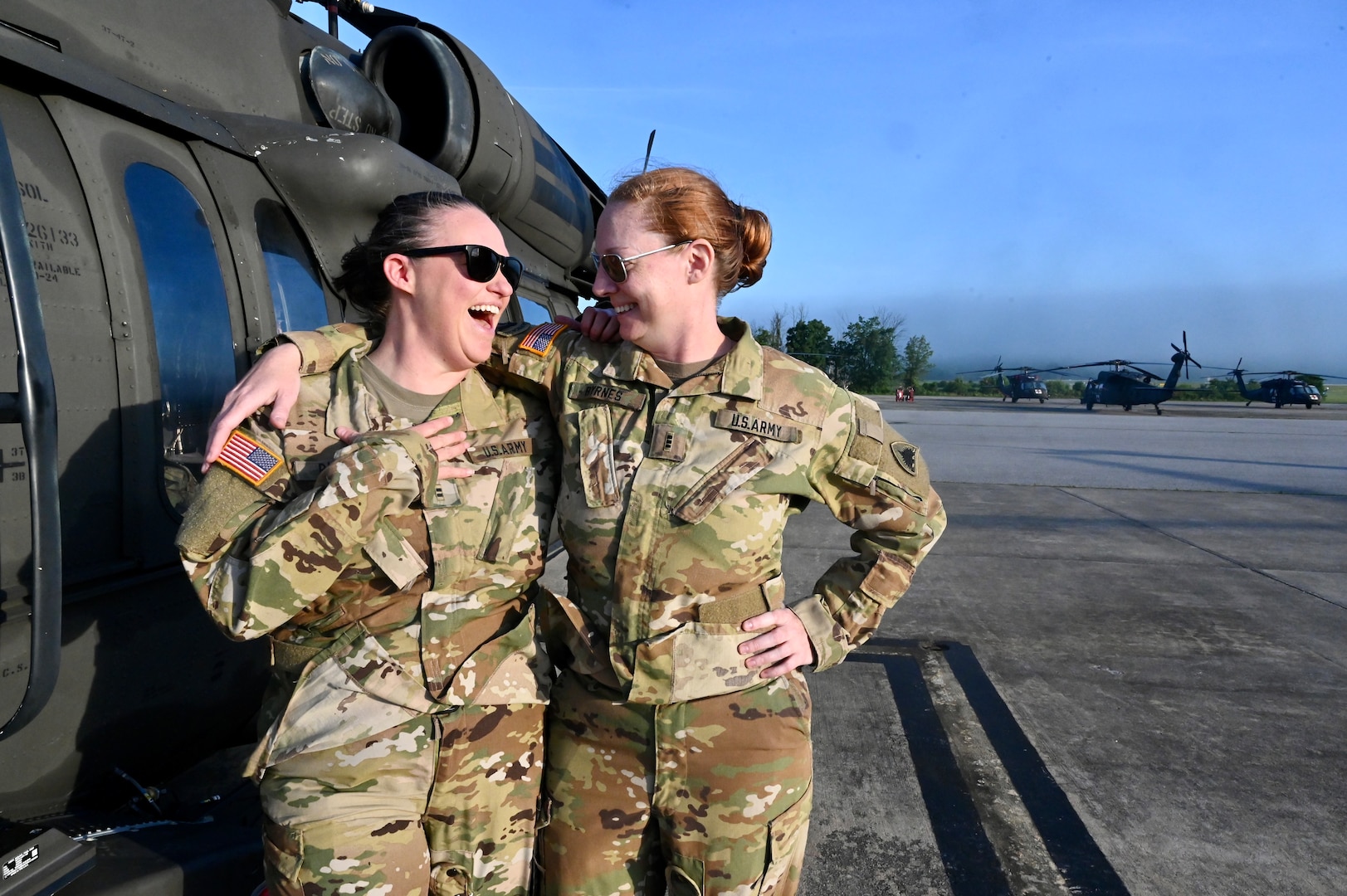 CW2 Lauren Bloch and CW3 Joy Byrnes, UH-60 Black Hawk pilots, District of Columbia National Guard, stand for a photograph at Davison Army Airfield, May 21, 2024. D.C. Army National Guard Aviation organized an all-female flight crew to commemorate the first woman to graduate Army flight school and the first female officer to achieve pilot status in June 1974.