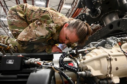 CW2 Lauren Bloch, UH-60 Black Hawk pilot, District of Columbia National Guard, conducts a preflight inspection at Davison Army Airfield, May 21, 2024. D.C. Army National Guard Aviation organized an all-female flight crew to commemorate the first woman to graduate Army flight school and the first female officer to achieve pilot status in June 1974.