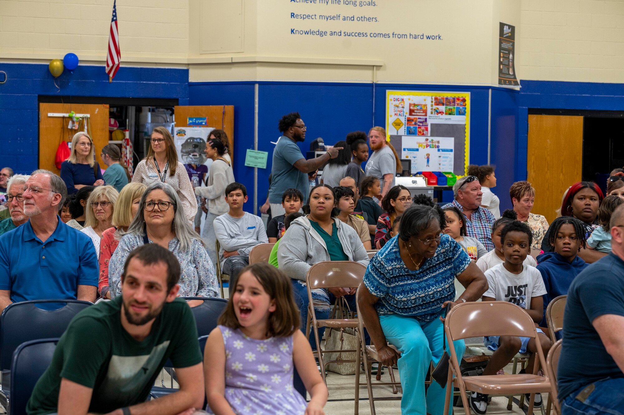 Community members, parents, students and past students of Clark Elementary watch the opening of the school’s time capsule in Wichita, Kansas, May 10, 2024. The time capsule dated back to the 2000-2001 school year.  (U.S. Air Force photo by Airman Paula Arce)