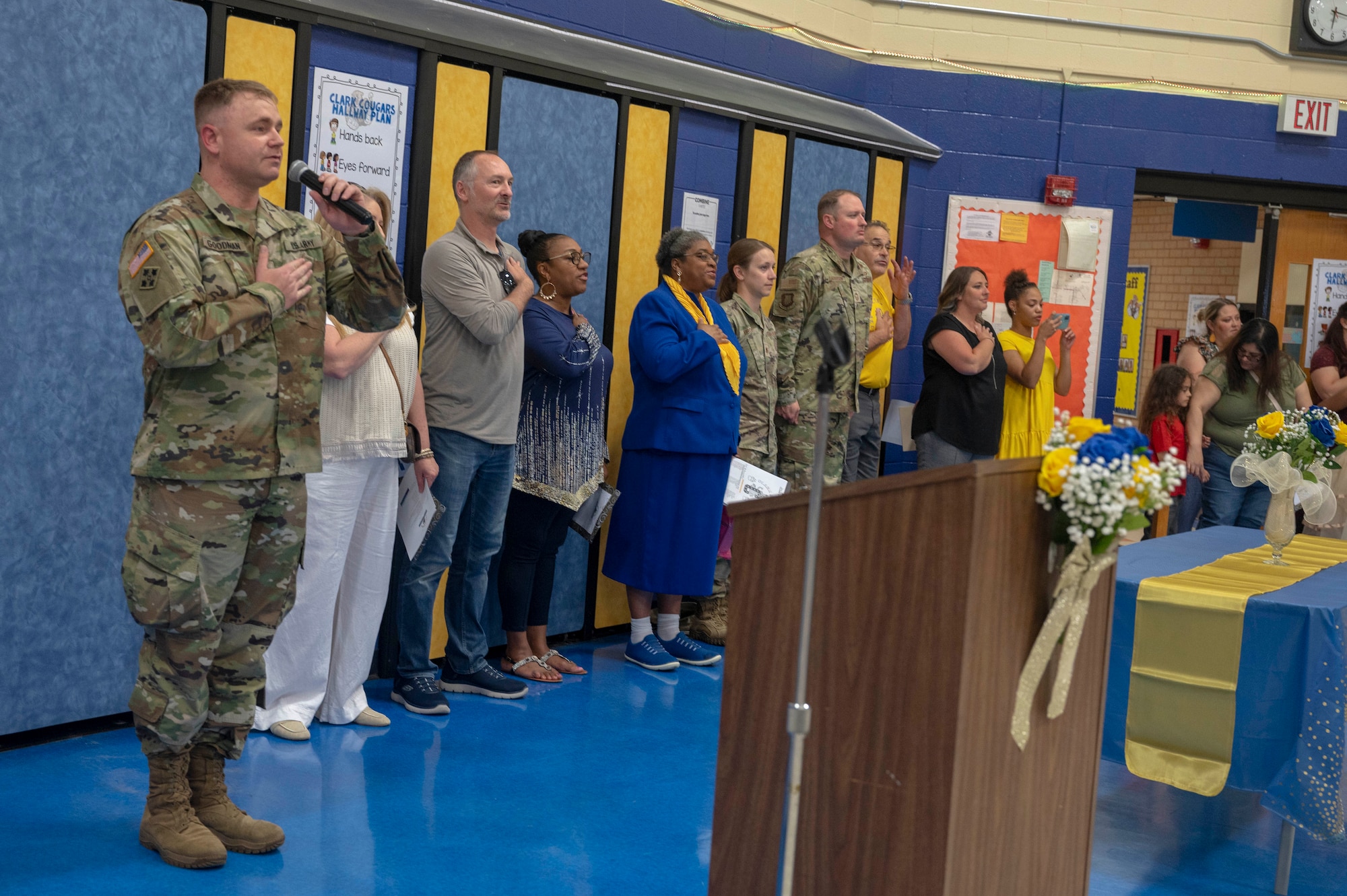 Attendees at Clark Elementary’s time capsule opening recite the Pledge of Allegiance in Wichita, Kansas, May 10, 2024. The Pledge of Allegiance was recited before the school recognized McConnell’s volunteer Airmen. (U.S. Air Force photo by Airman Paula Arce)