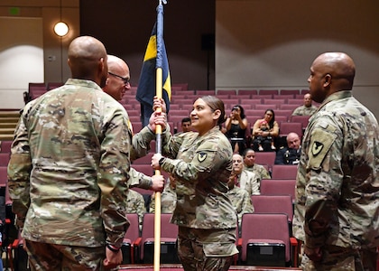 Soldier passes guidon to another Soldier