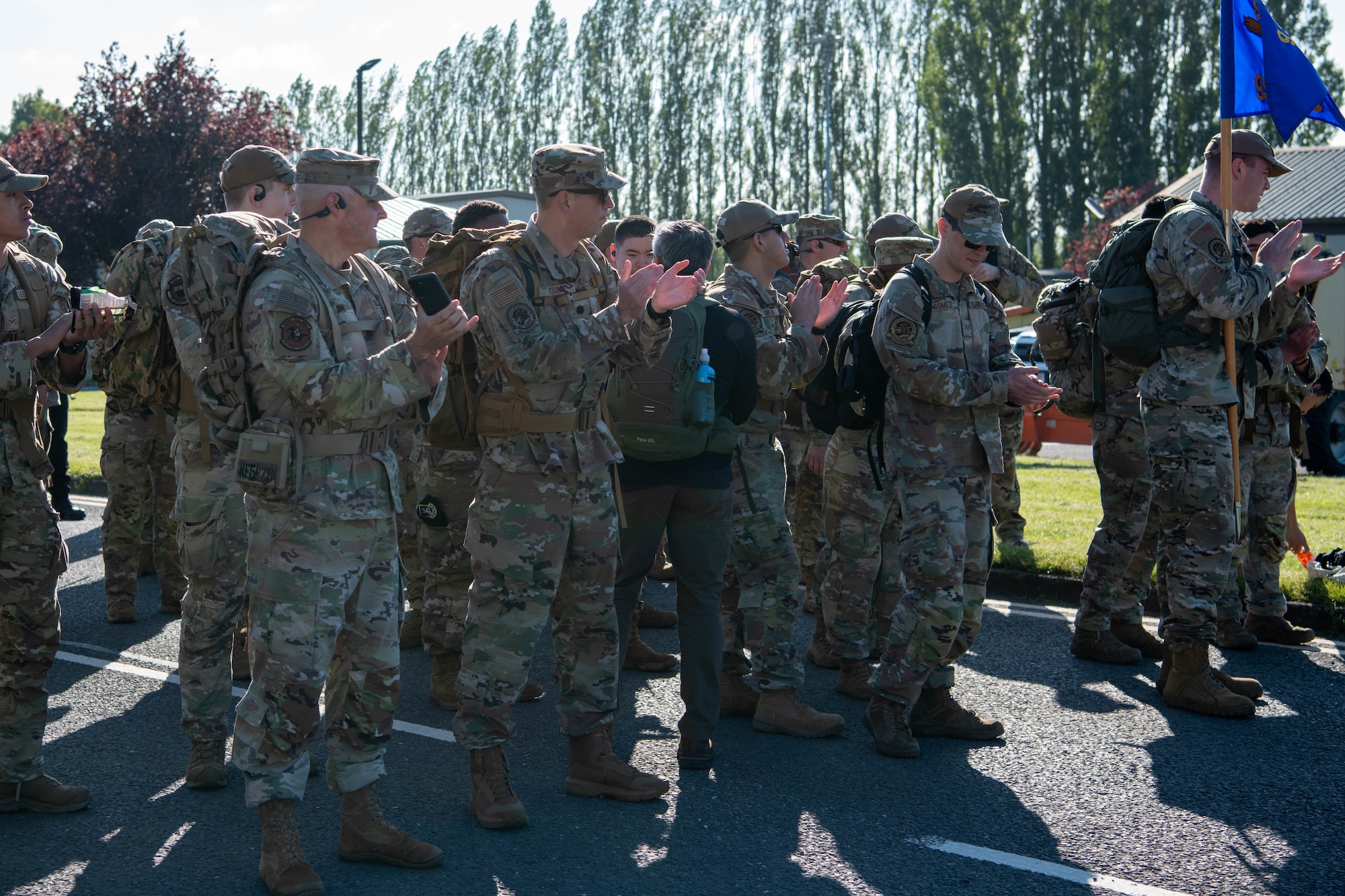 Airmen applaud before starting a Norwegian Foot March