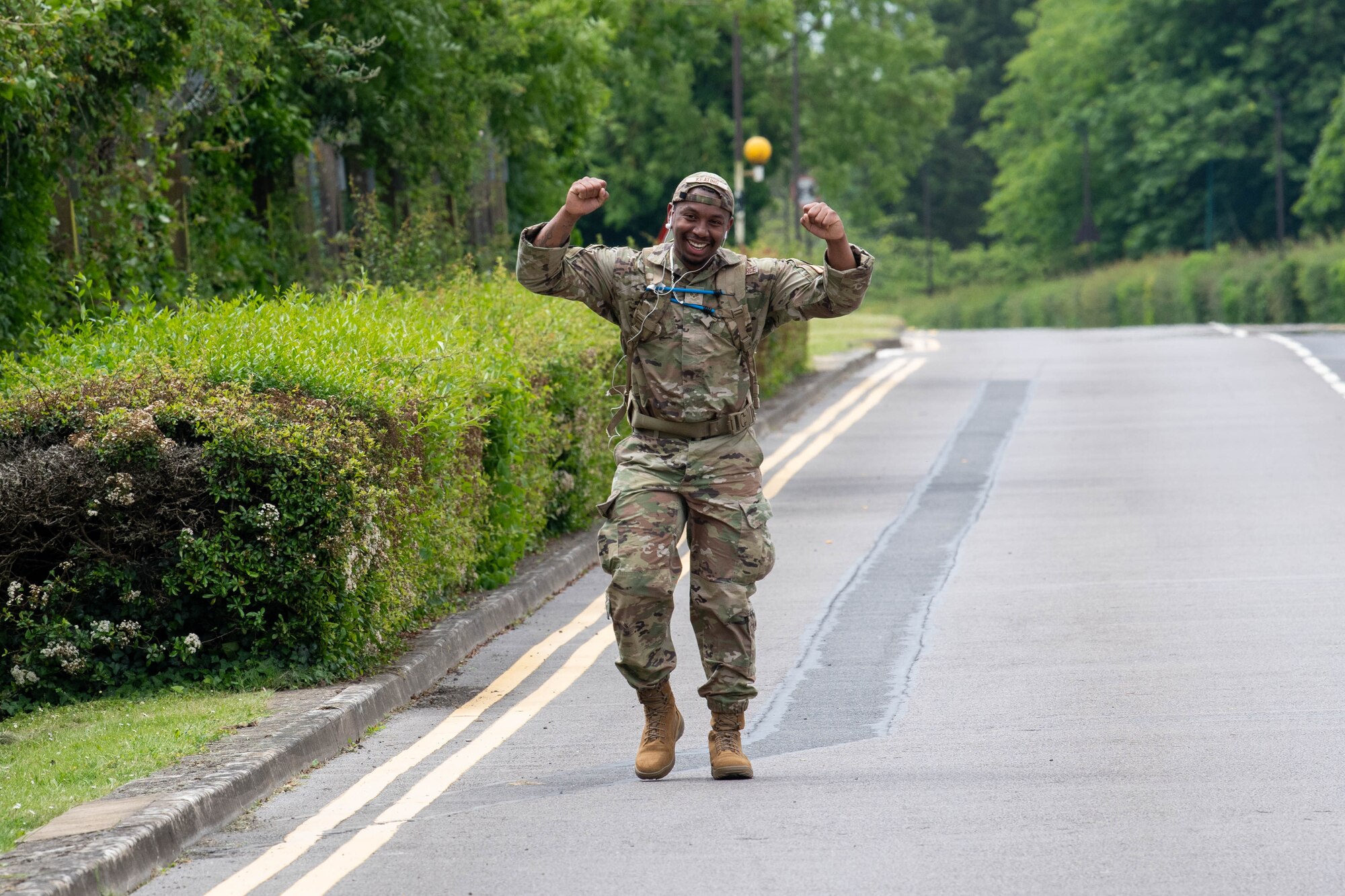 A competitor celebrates during the last stretch of a Norwegian Foot March