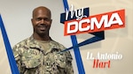 Smiling man wears a Navy camouflage uniform