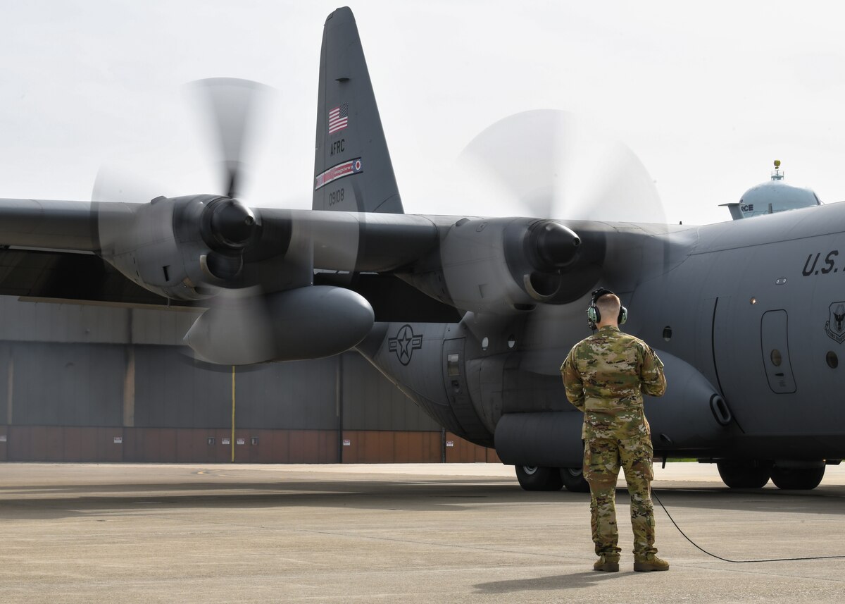 Tech. Sgt. Rayne Brophy, a loadmaster with the 757th Airlift Squadron, listens to preflight checklists procedures between aircrew prior to takeoff at Youngstown Air Reserve Station, Ohio, June 1, 2024