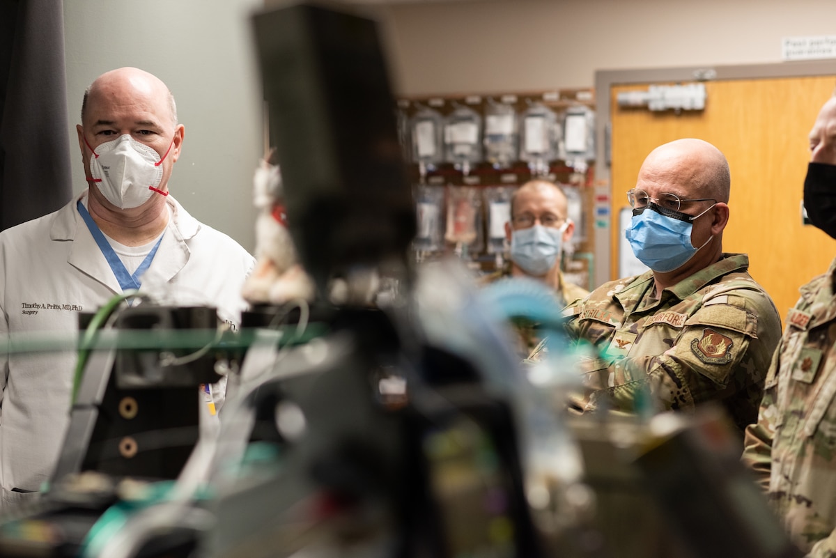 Dr. Timothy Pritts, left, chief of Trauma Critical Care and General Surgery and a trauma surgeon at the University of Cincinnati and UC Health, and Col. Richard Strilka, Center for Sustainment of Trauma and Readiness Skills, Cincinnati, research director, stand in the simulated Surgical Intensive Care Unit, or SICU, military aircraft room in the SICU at UC Medical Center – Cincinnati, Feb. 24, 2023. The Air Force’s 711th Human Performance Wing, part of the Air Force Research Laboratory, partnered with the University of Cincinnati to develop a state-of-the art simulation center for the Critical Care Air Transport team at the Center for Sustainment of Trauma Readiness at the University of Cincinnati Medical Center, in order to modernize training and strengthen community partnerships. (U.S. Air Force photo)