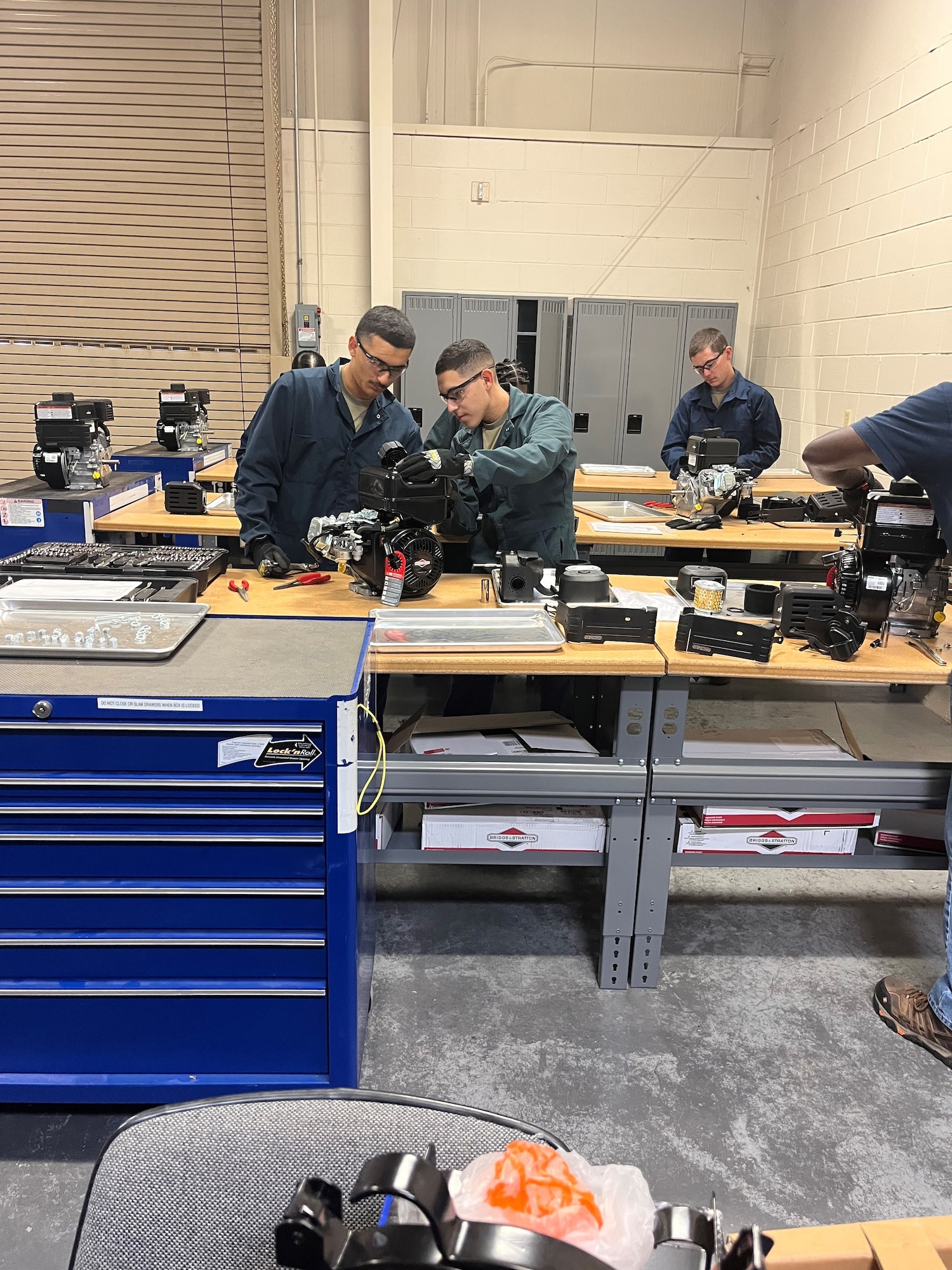 Airmen in Training work on equipment
