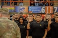 Future Soldiers during the Oath of Enlistment at the start of a basketball game in front of fans, family, and friends in Puerto Rico.