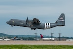 A C-130J Super Hercules assigned to the 123rd Airlift Wing takes off from the Kentucky Air National Guard Base in Louisville, Ky., May 22, 2024, bearing the distinctive livery displayed on U.S. aircraft during World War II. The plane will fly over France June 6 as part of observances for the 80th anniversary of D-Day, when Allied forces invaded Normandy to turn the tide of the war in Europe.