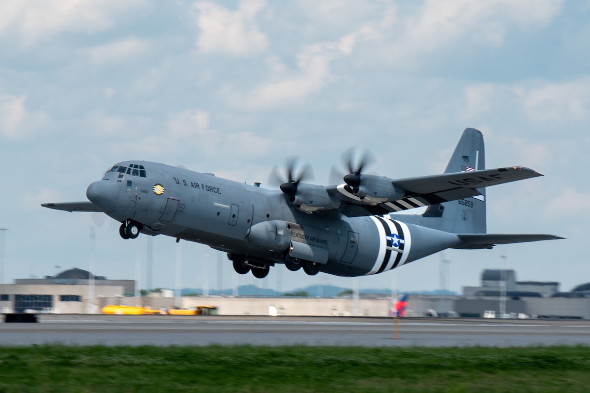 A C-130J Super Hercules assigned to the 123rd Airlift Wing takes off from the Kentucky Air National Guard Base in Louisville, Ky., May 22, 2024, bearing the distinctive livery displayed on U.S. aircraft during World War II. The plane will fly over France on June 6 as part of observances for the 80th anniversary of D-Day, when Allied forces invaded Normandy to turn the tide of the war in Europe. (U.S. Air National Guard photo by Phil Speck)