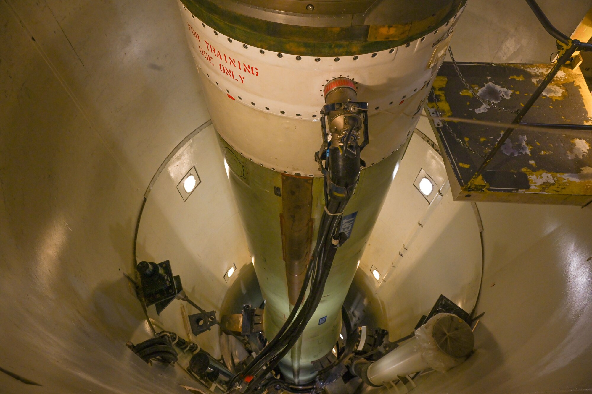The Honorable Anniken Krutnes, Norway's Ambassador to the United States, views a replica of the Minuteman III Intercontinental Ballistic Missile (ICBM) while touring a simulated launch facility at Minot Air Force Base, North Dakota, May 30, 2024. Minuteman III ICBMs have provided a quick-reacting, inertially guided, highly survivable component to America's strategic deterrent program since its inception in 1962. (U.S. Air Force photo by Airman 1st Class Trust Tate)