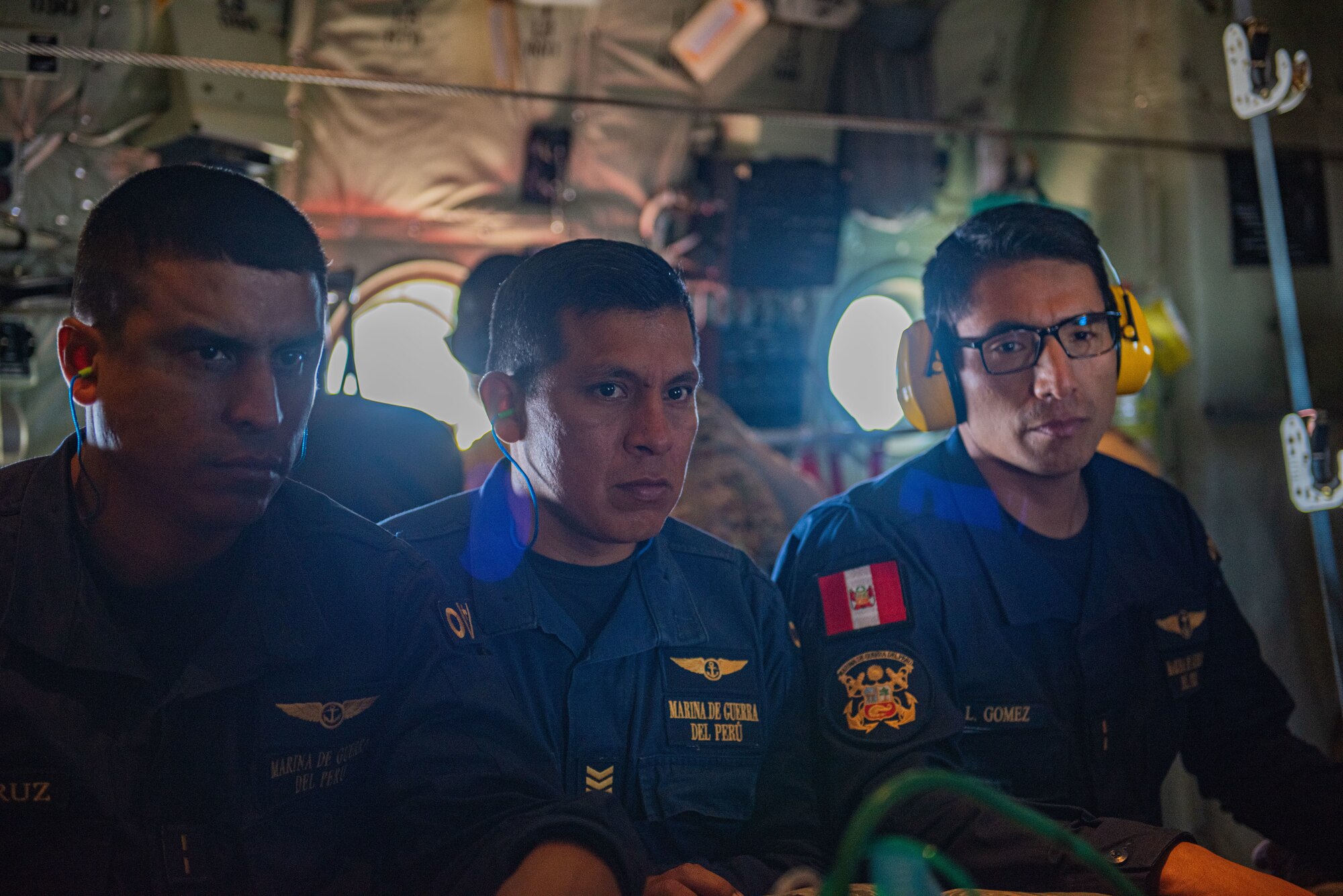 Peruvian Coast Guardsmen spectate an aeromedical evacuation training during Resolute Sentinel 2024 in Lima, Peru, May 30, 2024. Exercise RS24 is an opportunity for cultural and tactical integration between the U.S. and its allied Latin American nations. (U.S. Air force photo by Airman 1st Class Sir Wyrick)