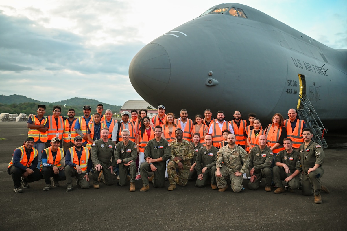 The 68th Airlift Squadron crew, call sign “Reach 2087”, which delivered 166,000 pounds of humanitarian aid to Panama pose for a group photo with members of King’s Castle Foundation (Fundación Castillo Del Rey), a Panamanian non-governmental organization distributing the aid to those in need, on the tarmac at Panama Pacifico International Airport June 1, 2024.