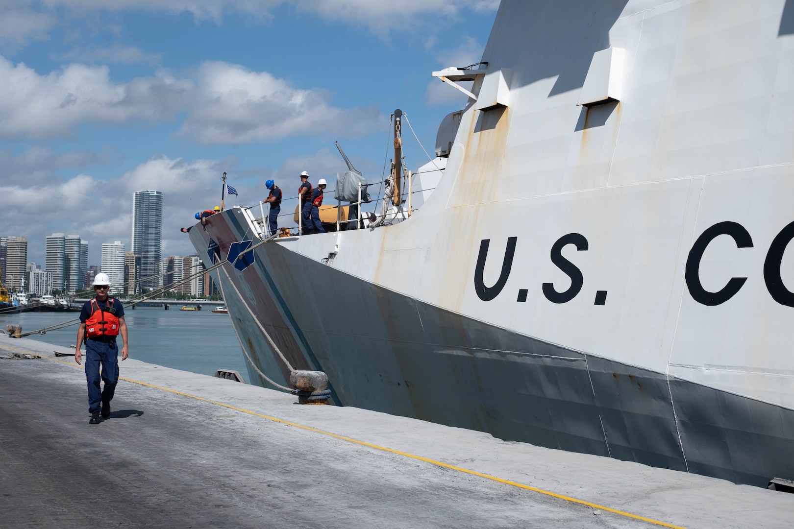 U.S. Coast Guard Chief Warrant Officer 2 Steven Wrigley, a crewmember assigned to U.S. Coast Guard Cutter James (WMSL 754), walks the pier in the Port of Fortaleza, Brazil, June 3, 2024. James’ port visit to Fortaleza is part of the cutter's current deployment in support of Operation Southern Cross, strengthening relationships and laying the foundation for increased partnerships to counter illicit maritime activity. (U.S. Coast Guard photo by Petty Officer 3rd Class Logan Kaczmarek)