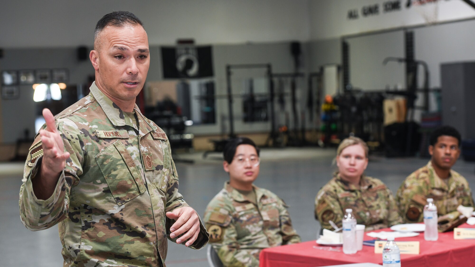 Chief Master Sergeant talks to Airmen