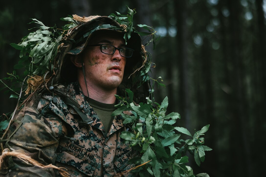 U.S. Marine Corps Lance Cpl. William Sauerland III, a Mayville, New York native and an assistant patrol leader with 1st  Battalion, 6th Marine Regiment, 2d Marine Division, conducts a patrol during the Division Signals and Emissions Course (DSEC) on Camp Lejeune, North Carolina, May 20, 2024. Division Training Company held DSEC in order to increase proficiency and understanding of light infantry operations in a contested and communications degraded environment. (U.S. Marine Corps photo by Cpl. Alexis Sanchez)