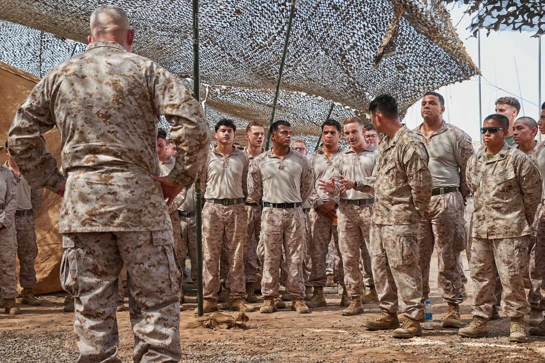 U.S. Marine Corps Capt. Caleb Johnson, an Air Defense Control Officer assigned to Bravo Company, Marine Air Control Squadron (MACS-2) 2, asks Maj. Gen. Sofge Jr., Commander, U.S. Marine Corps Forces Europe and Africa, a question at Camp Lemonnier, Djibouti, on May 31, 2024. MACS-2 is essential for air command and control, air traffic management, and air defense coordination, ensuring the success of Marine Air-Ground Task Force operations by maintaining air superiority and protecting ground forces in combat and support missions. (U.S. Marine Corps photo by Cpl. Mary Linniman)