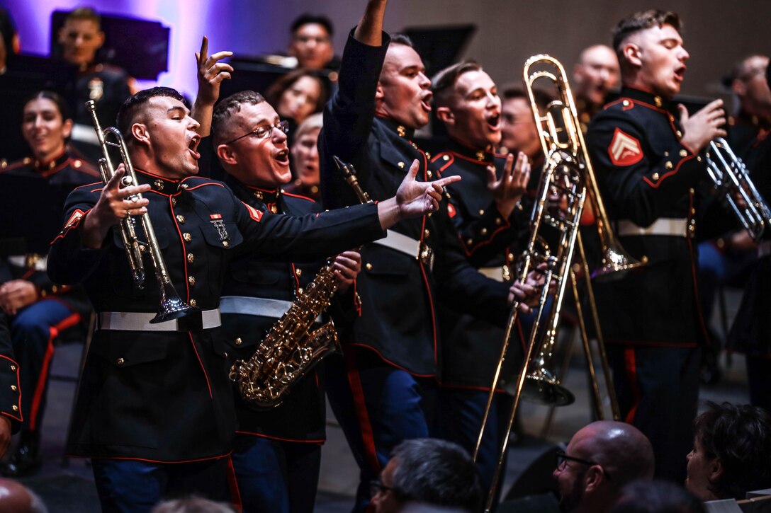 U.S. Marines with the 2d Marine Division brass band sing for the audience during a concert at Cite de la Musique et de la Danse, Soissons, France May 24, 2024. The band supported various concerts and parades in multiple cities across France in preparation for the 2024 Belleau Wood Ceremony. (U.S. Marine Corps photo by Sgt. Alexa M. Hernandez)