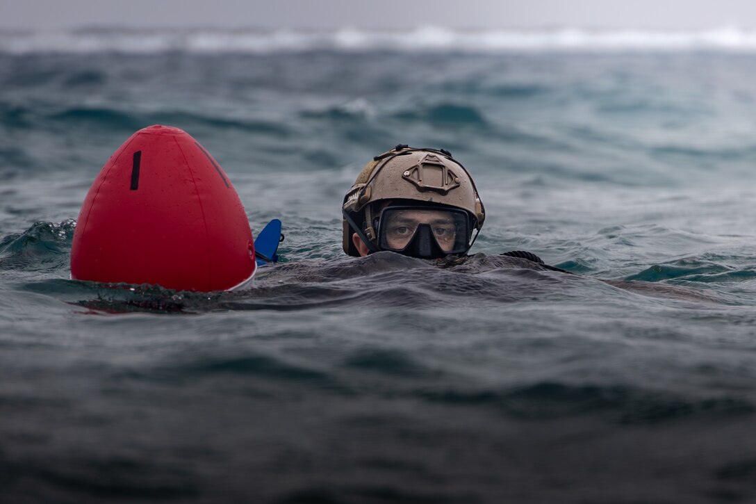 U.S. Marine Corps Cpl. Luke Miller, a Bristow, Oklahoma native and a reconnaissance Marine with 2d Reconnaissance Battalion (Recon), 2d Marine Division, conducts a tactical peek during Exercise Caribbean Coastal Warrior in Savaneta, Aruba, May 21, 2024. This bilateral training exercise with Dutch forces allowed 2d Recon to expand its knowledge and proficiency when operating in littoral and coastal regions. (U.S. Marine Corps photo Cpl. Joshua Kumakaw)
