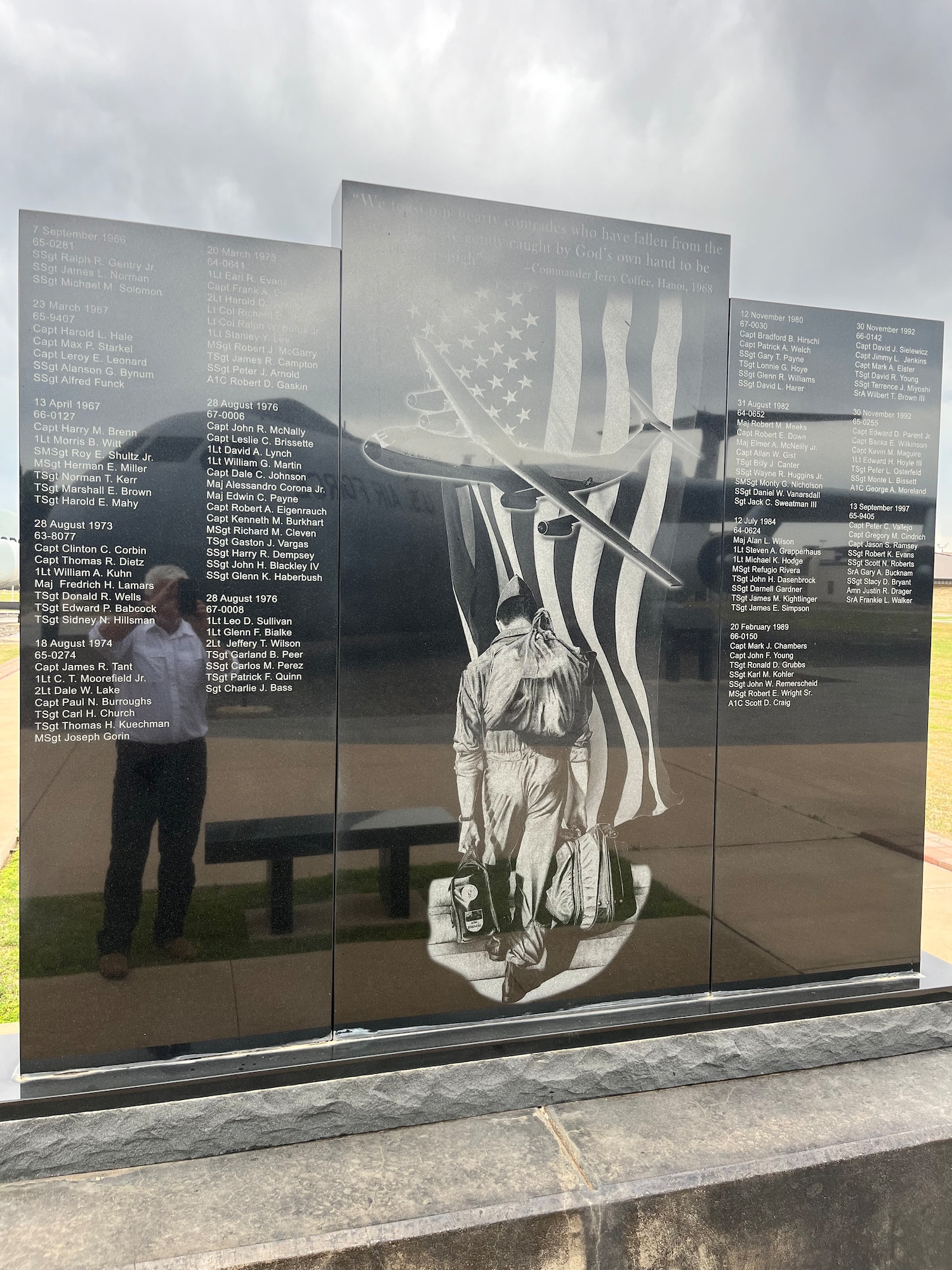 Retired U.S. Air Force Lt. Col Herbert Bailey takes a photo of the C-141 Starlifter aircraft memorial at Altus Air Force Base, Oklahoma, April 15, 2024. Bailey and the aircraft can be seen in the reflection of the memorial. (U.S. Air Force photo by Nicole Valence)