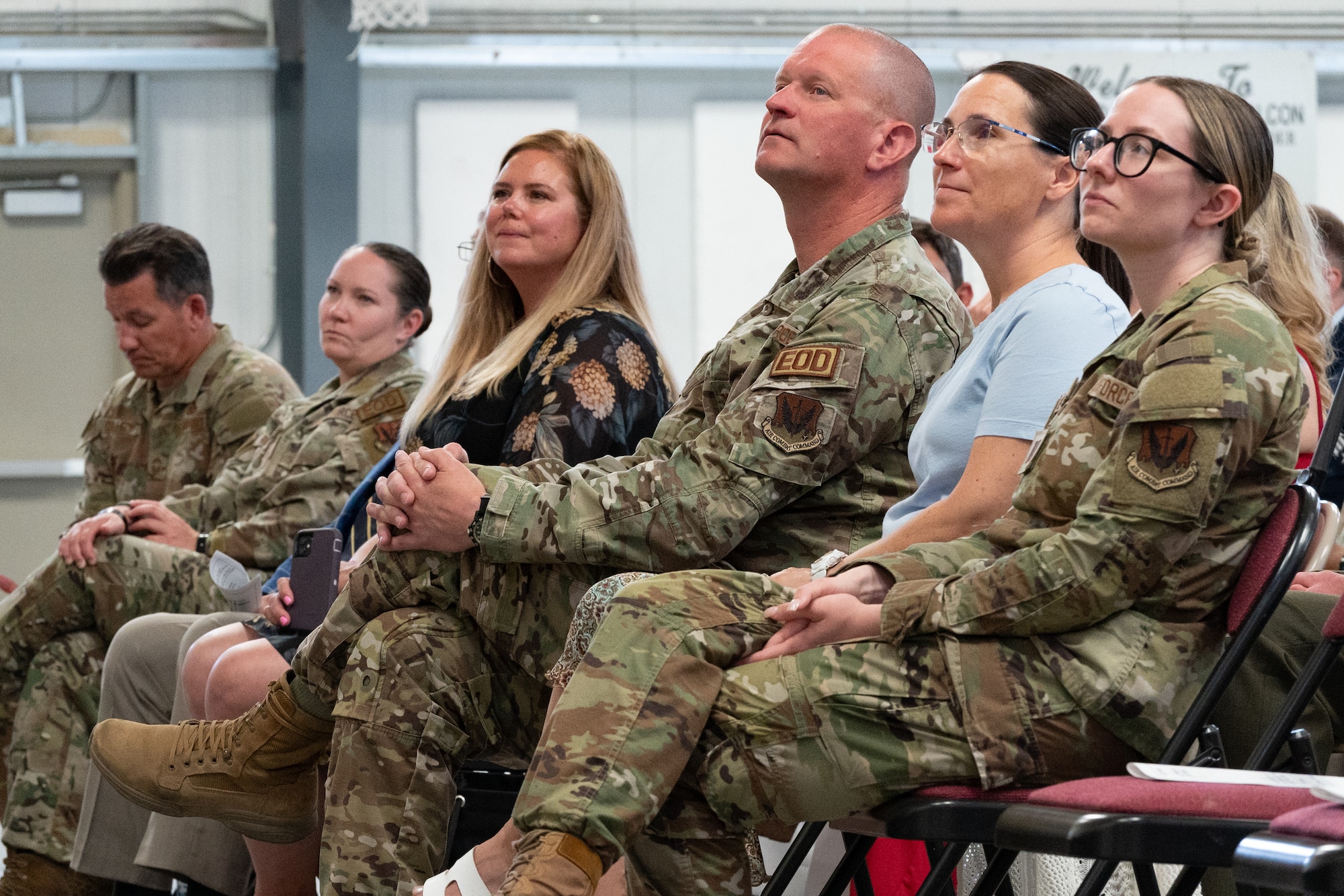 U.S. Air Force Col. Joshua DeMotts, center, listens to a speech given by the awardee at an Airman’s Medal presentation at Nellis Air Force Base, Nevada, May 30, 2024.