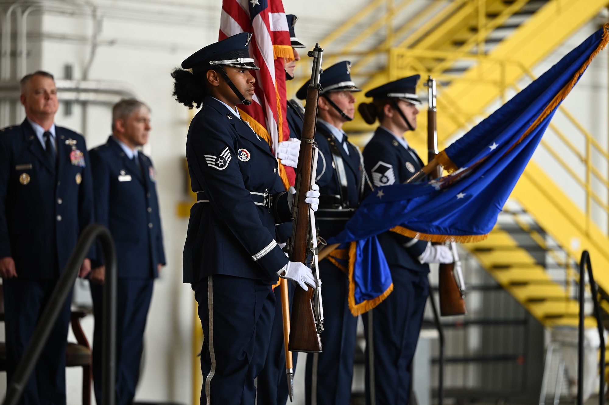 Maj. Gen. D. Scott Durham, Fourth Air Force commander, and Col. Douglas Perry, Jr., incoming 445th Airlift Wing commander, stand at attention as members of the 445th Airlift Wing Honor Guard present the Colors during the 445th Airlift Wing Assumption of Command ceremony held at Wright-Patterson Air Force Base, Ohio June 1, 2024.  Col. Perry assumed command of the wing after serving as the commander of the 434th Operations Group, Grissom Air Reserve Base, Indiana. (U.S. Air Force photo/Master Sgt. Patrick O’Reilly)