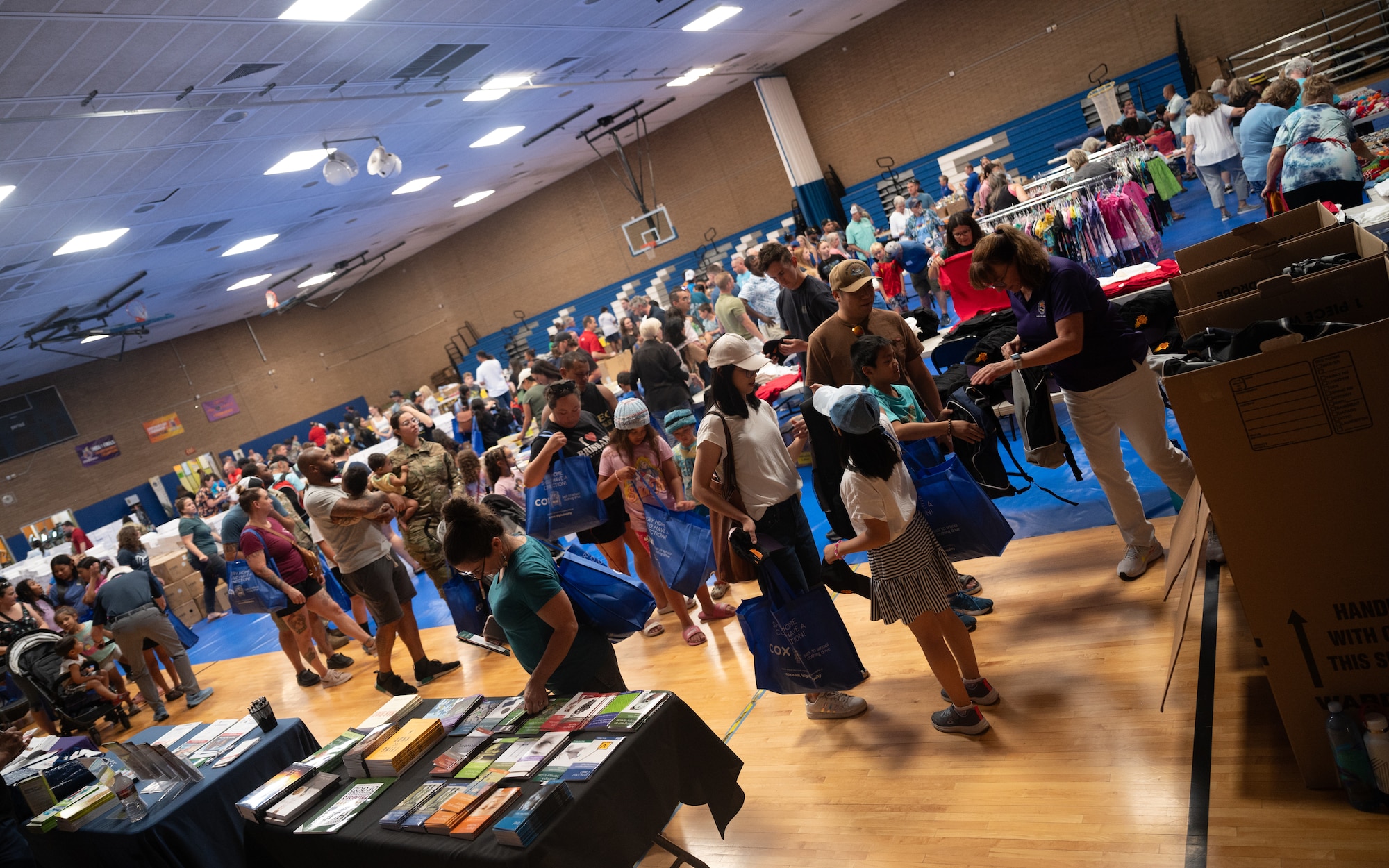 Airmen and families gather during a Back-to-School Bash event June 1, 2024, at Luke Air Force Base, Arizona.