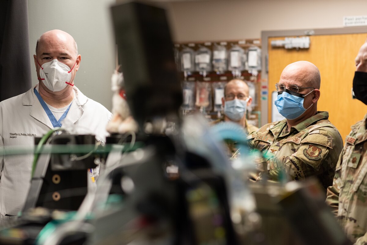 Dr. Timothy Pritts, left, chief of Trauma Critical Care and General Surgery and a trauma surgeon at the University of Cincinnati and UC Health, and Col. Richard Strilka, Center for Sustainment of Trauma and Readiness Skills, Cincinnati, research director, stand in the simulated Surgical Intensive Care Unit, or SICU, military aircraft room in the SICU at UC Medical Center – Cincinnati, Feb. 24, 2023. The Air Force’s 711th Human Performance Wing, part of the Air Force Research Laboratory, partnered with the University of Cincinnati to develop a state-of-the art simulation center for the Critical Care Air Transport team at the Center for Sustainment of Trauma Readiness at the University of Cincinnati Medical Center, in order to modernize training and strengthen community partnerships. (U.S. Air Force photo)