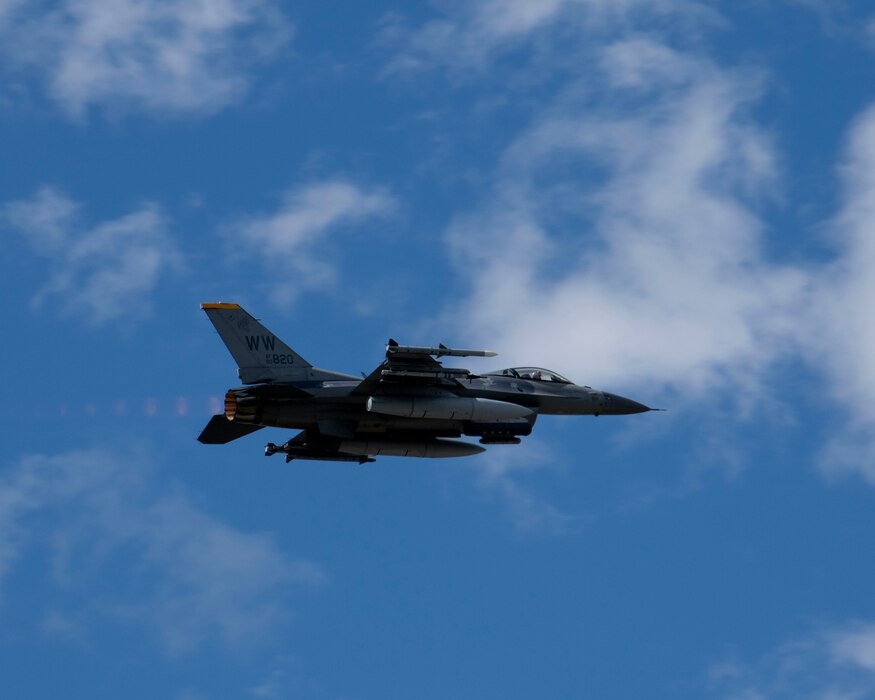 An F-16 aircraft flies in in the sky